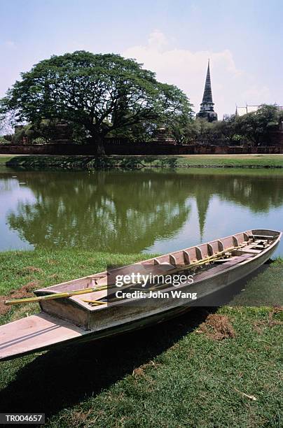 small boat with buddhist temple - wange an wange stock pictures, royalty-free photos & images
