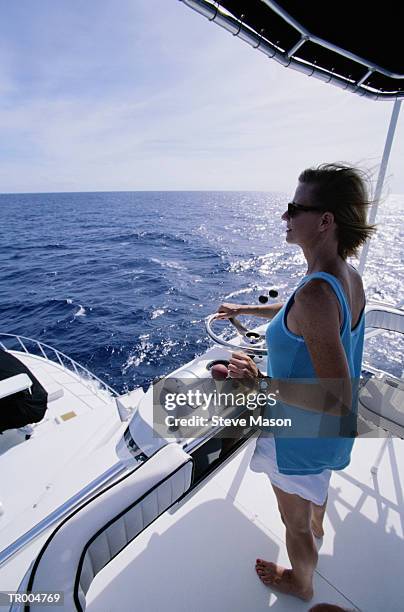 woman at the helm - nautical vessel part foto e immagini stock