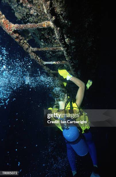 diver exploring shipwreck - unknown gender stock pictures, royalty-free photos & images