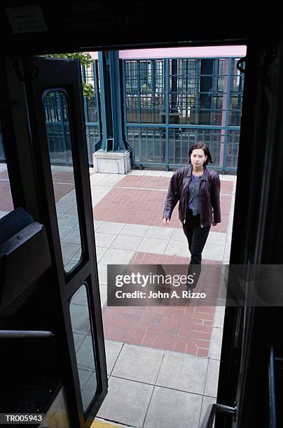 woman entering bus - only mid adult women stock pictures, royalty-free photos & images