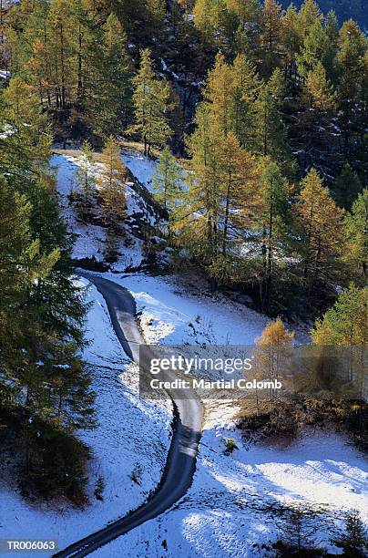 country road in the snow - martial ストックフォトと画像