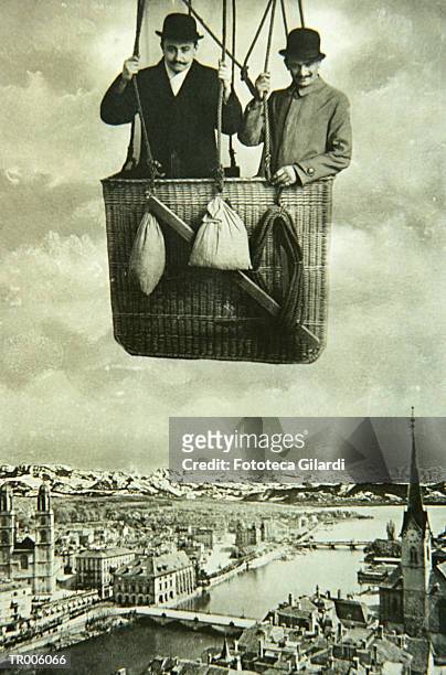 men in balloon over a european city - only men stockfoto's en -beelden