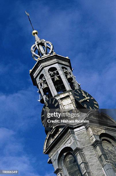clock tower in amsterdam - north holland stock pictures, royalty-free photos & images
