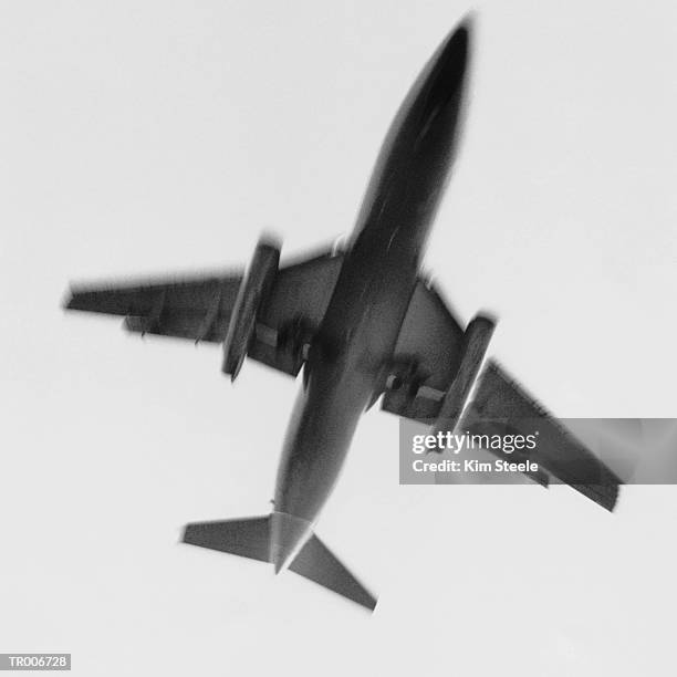 airplane from below - steele stock pictures, royalty-free photos & images