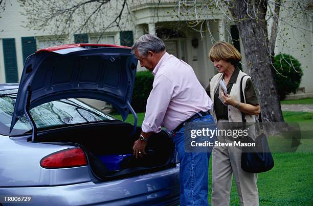 couple packing car - steve stock pictures, royalty-free photos & images