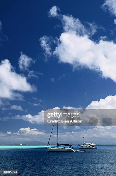 boats off huahine island, french polynesia - society islands stock pictures, royalty-free photos & images