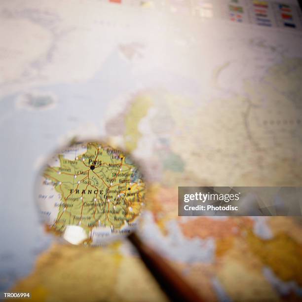 map of france under a magnifying glass - france foto e immagini stock