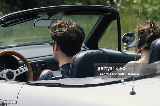 couple in a convertible car - bavosi ストックフォトと画像