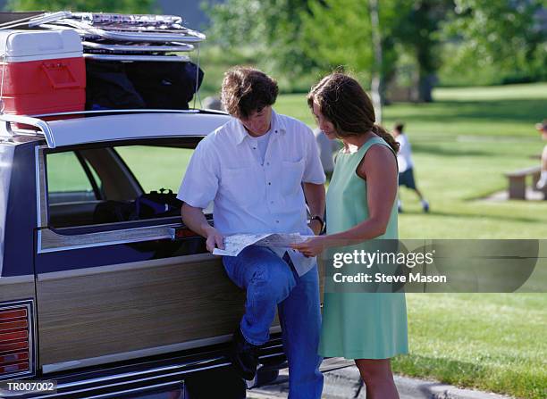 tourist looking at a map - steve stock pictures, royalty-free photos & images