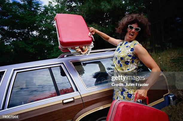 angry woman with luggage - only mid adult women stock-fotos und bilder