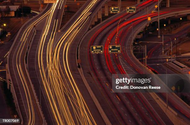 aerial view of a texas freeway at night - vehicle light stock pictures, royalty-free photos & images