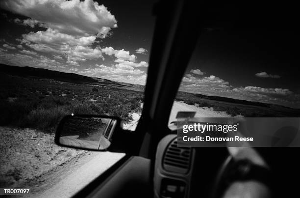 desert through a car window - unknown gender stock pictures, royalty-free photos & images