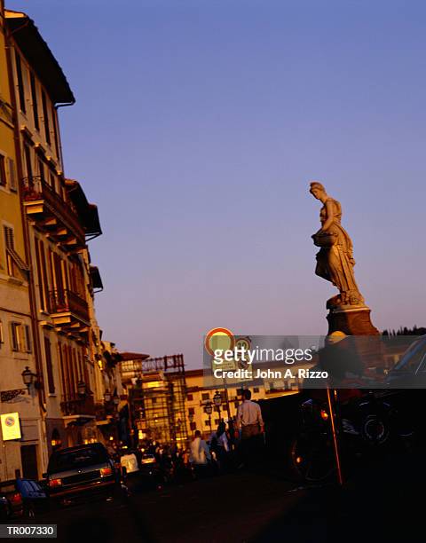 statue above a street in florence, italy - norwegian royal family attends the unveiling of a statue of king olav v in oslo stockfoto's en -beelden