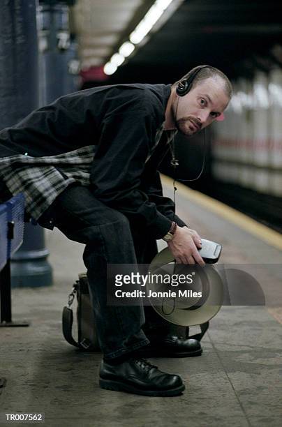 man waiting for the subway - for stock-fotos und bilder