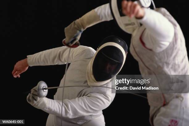 fencing, competitors in action - face guard sport stock pictures, royalty-free photos & images