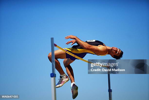 athletics, high-jump competitor clearing bar - high jumper stock pictures, royalty-free photos & images