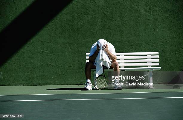 tennis player on bench - sports bench stock pictures, royalty-free photos & images