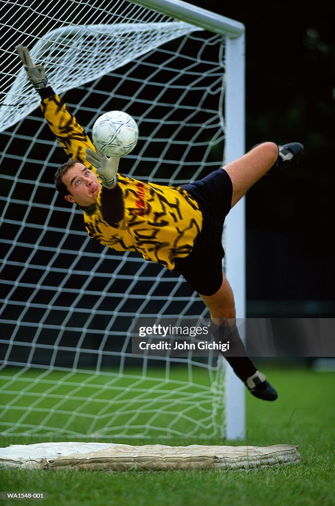 Soccer, goalkeeper leaping for save