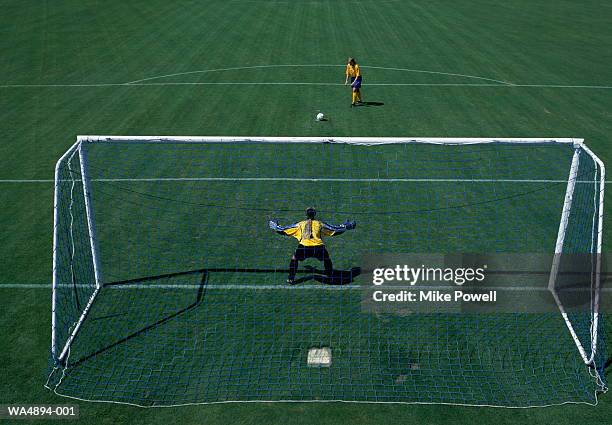 woman taking penalty kick - woman goalie stock pictures, royalty-free photos & images