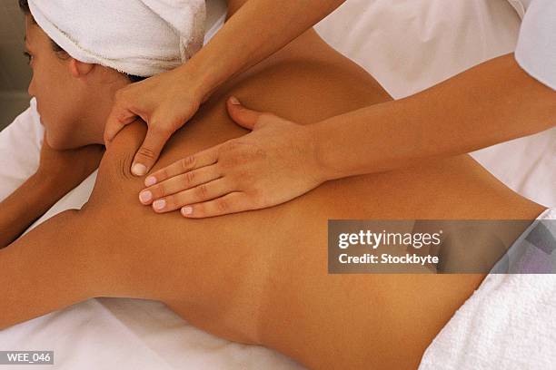 woman getting back massage - human joint stock pictures, royalty-free photos & images