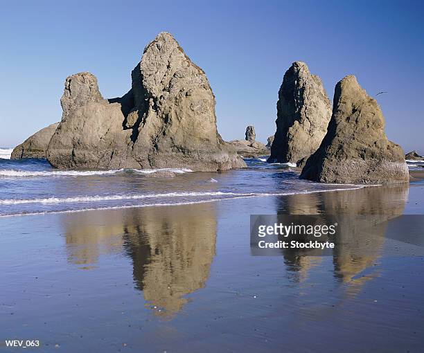 beach with rock formations - rock ストックフォトと画像