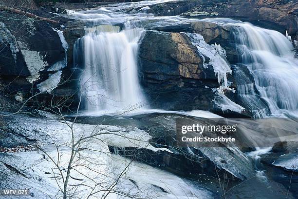 water cascading over rocks - valley side stock-fotos und bilder