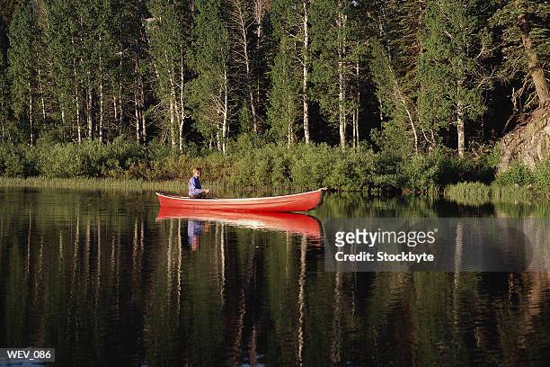 man canoeing on lake - the lady garden gala hosted by chopard in aid of silent no more gynaecological cancer fund cancer research uk stockfoto's en -beelden
