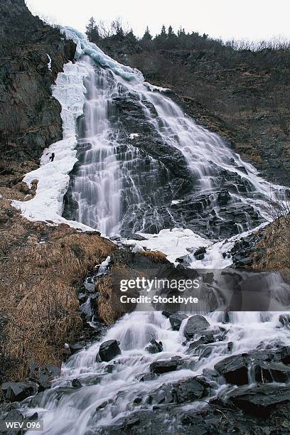 mountain waterfall - valley side stock-fotos und bilder