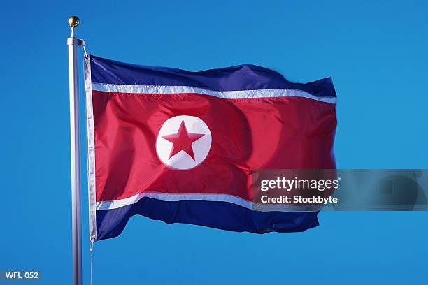 flag of north korea - stars of formula one and music make a noise at abbey road studios to help children locked away in orphanages stockfoto's en -beelden