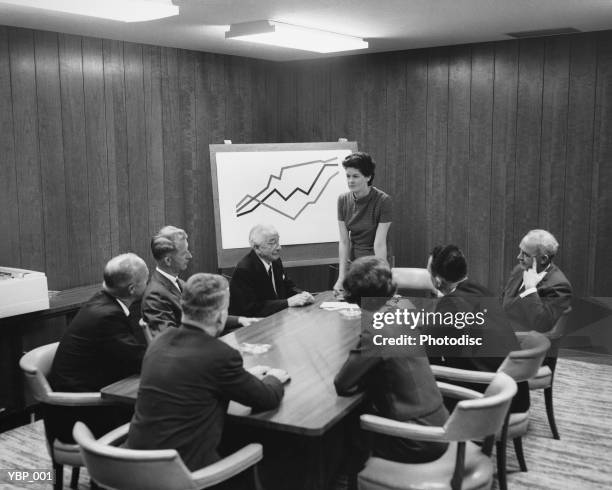 woman giving presentation to group in meeting - next to bildbanksfoton och bilder