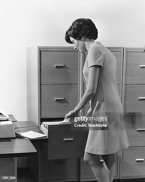 Someone Filing Paper Woman Filing Paperwork Photos and Premium High Res Pictures - Getty Images