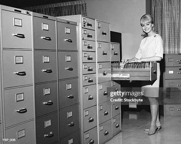 woman filing - file photo stock pictures, royalty-free photos & images