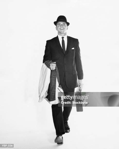man walking, carrying briefcase and jacket - only mid adult men stock pictures, royalty-free photos & images