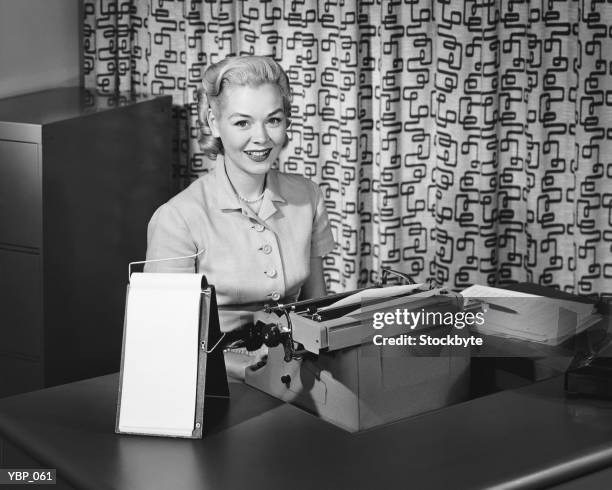 woman typing, smiling and posing - only mid adult women stock pictures, royalty-free photos & images