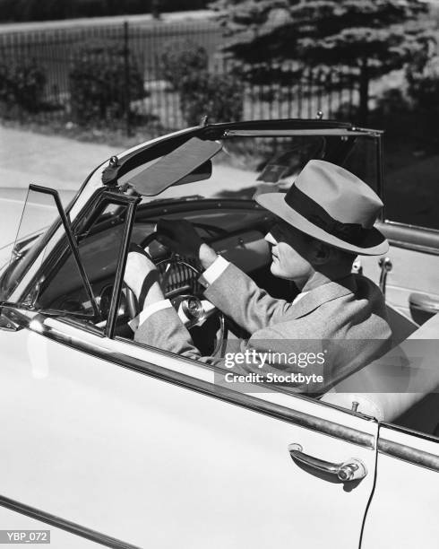 man driving convertible - alleen oudere mannen stockfoto's en -beelden