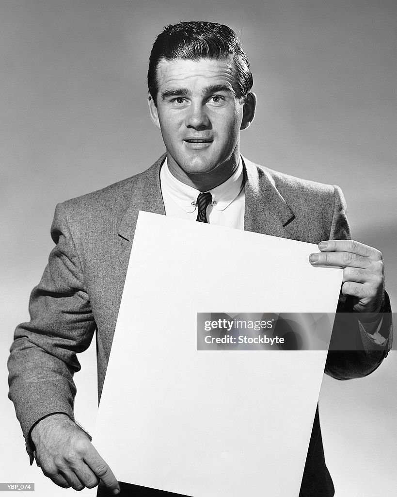 Man holding blank paper