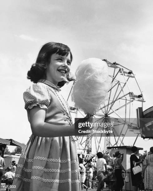 girl eating cotton-candy at fair - 1950 bildbanksfoton och bilder