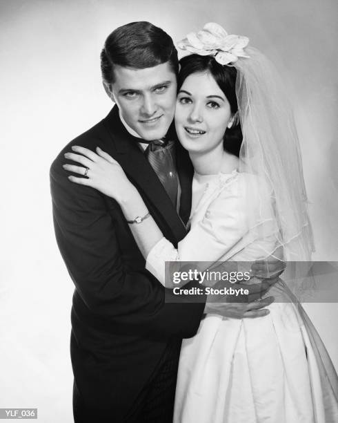 bride and groom hugging - 1950s couple stock pictures, royalty-free photos & images