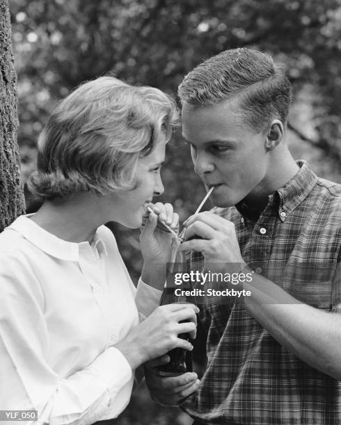 young couple sharing soda - soda bildbanksfoton och bilder
