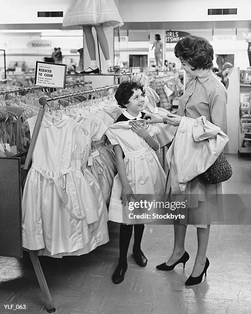mother and daughter shopping for clothes - retail of amorepacific corp brands as south koreas biggest cosmetics makers revamps product lineup stockfoto's en -beelden