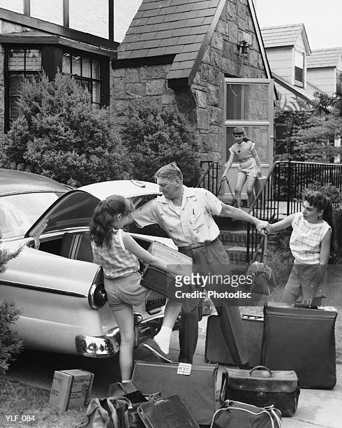 father and three daughters loading trunk with luggage - his and hers stock pictures, royalty-free photos & images