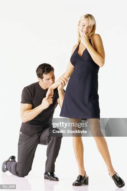 man kneeling beside woman, kissing her hand - her fotografías e imágenes de stock