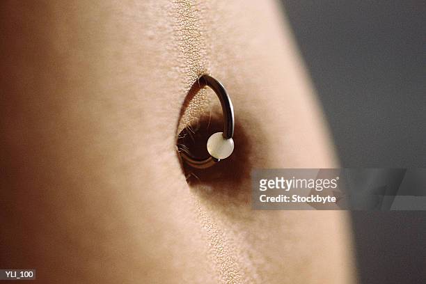 belly button ring, close-up - body modification stock-fotos und bilder