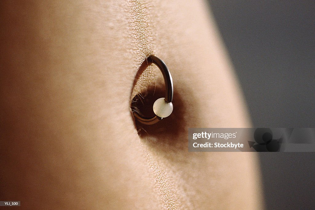 Belly button ring, close-up