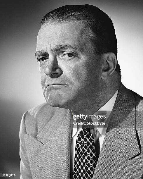 man frowning - alleen oudere mannen stockfoto's en -beelden