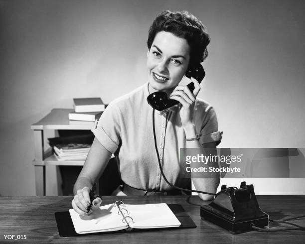 woman answering phone - secretary stock pictures, royalty-free photos & images