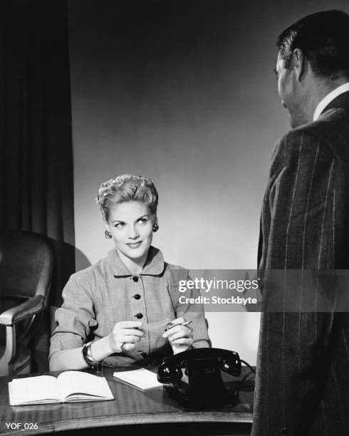 woman sitting, listening to man - next to stock pictures, royalty-free photos & images