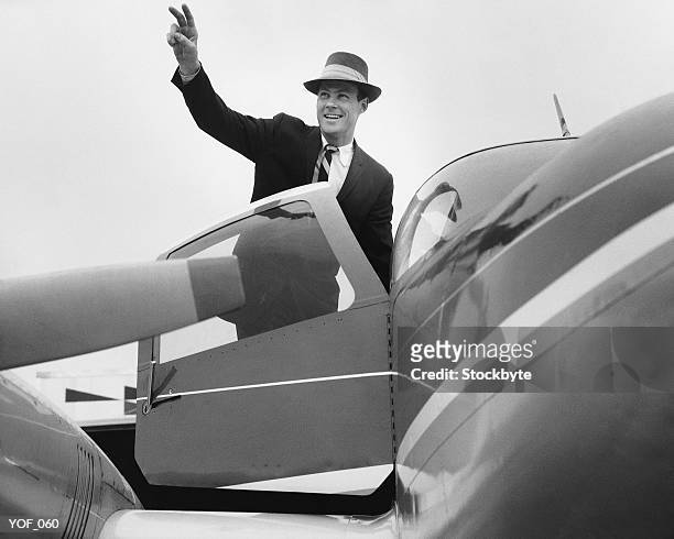 man waving, getting in plane - only mid adult men stock pictures, royalty-free photos & images
