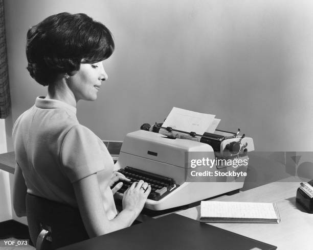 woman typing - old typewriter stock pictures, royalty-free photos & images