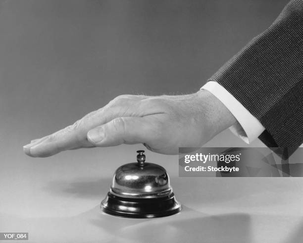 hand ringing bell - bell fotografías e imágenes de stock